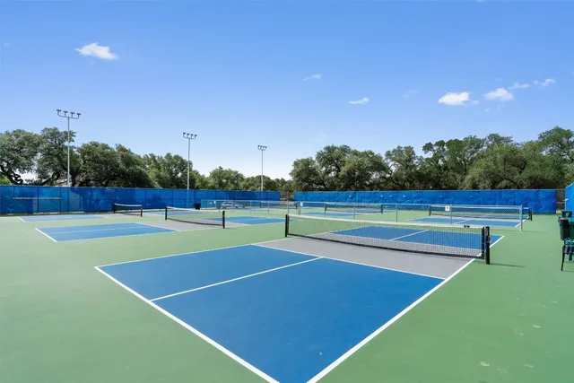 a view of an outdoor space and basketball court