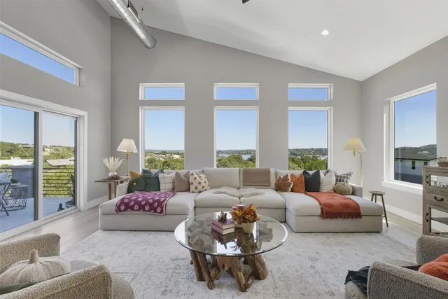 a living room with furniture and a large window