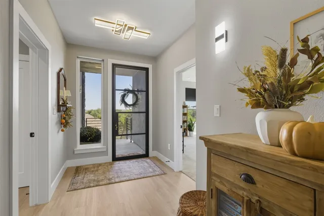a living room with furniture and potted plant