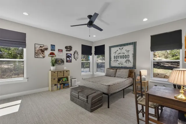 a bed room with furniture and window