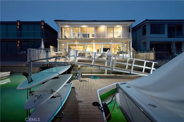 a view of a room with wooden floor and windows