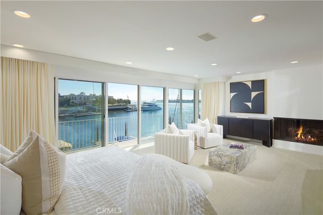 a bedroom with a large bed and a large window