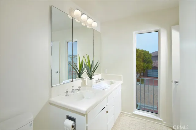 a bathroom with a sink a mirror and a shower
