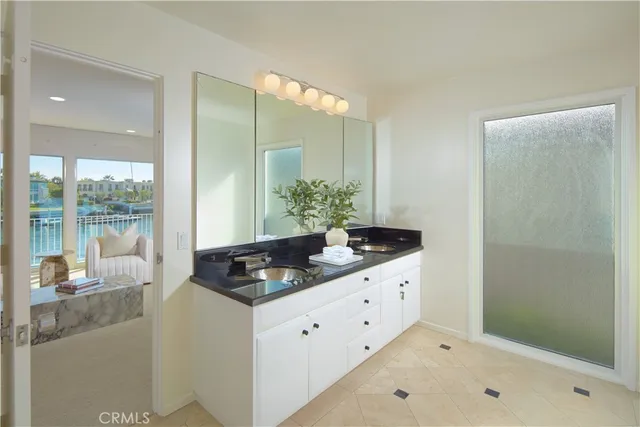 a kitchen with granite countertop a sink and a stove