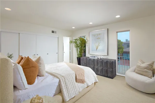 a bedroom with a bed and a couch