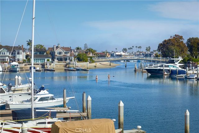 a view of a lake with boats and trees