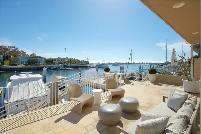 a view of a roof deck with furniture