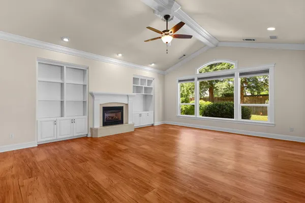a view of a kitchen with a sink and a refrigerator