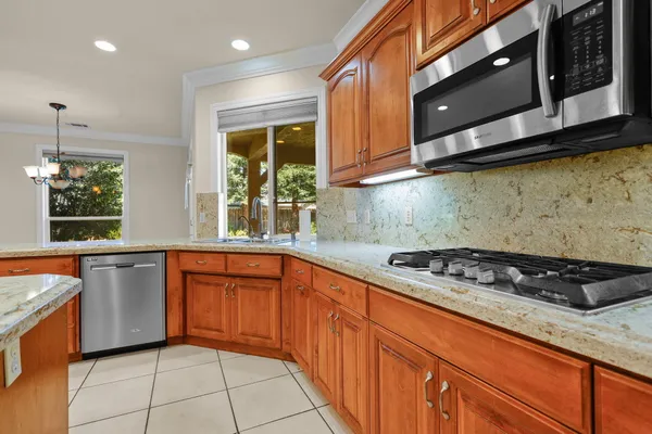 a bedroom with a large bed and a potted plant