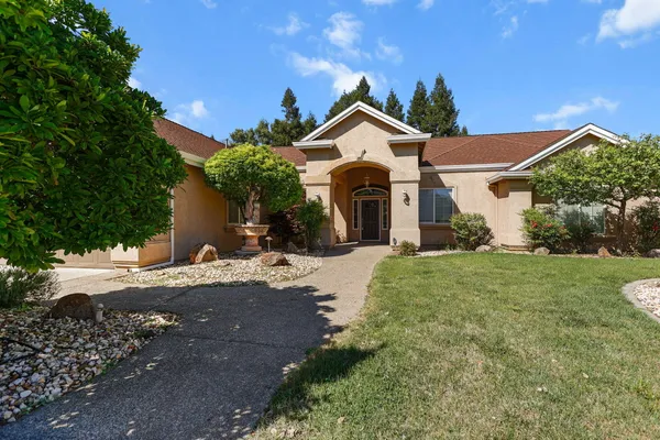 a front view of a house with a yard