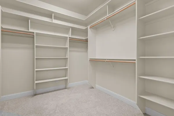 a spacious bathroom with a tub sink shower and mirror