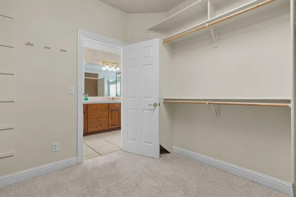 a bathroom with a tub a sink and a large mirror