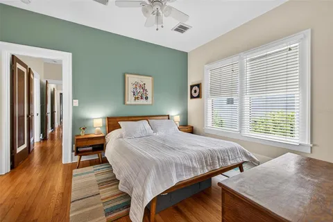a bedroom with a bed and a table