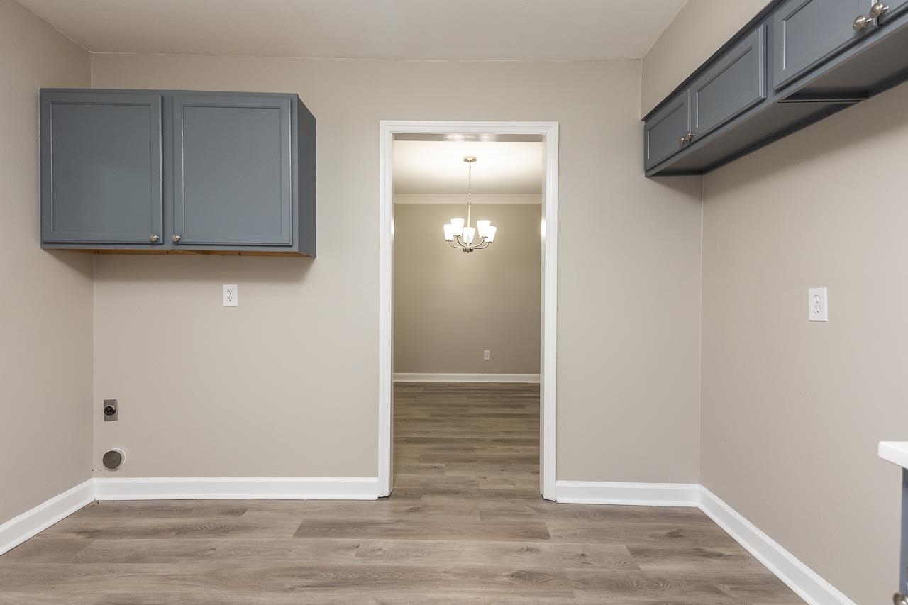 4574 Boyce Road Memphis, TN 38117 - Photo 11 of 28 a view of an empty room with wooden floor and a window