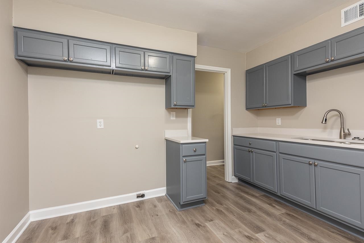 4574 Boyce Road Memphis, TN 38117 - Photo 15 of 28 a kitchen with a sink and cabinets