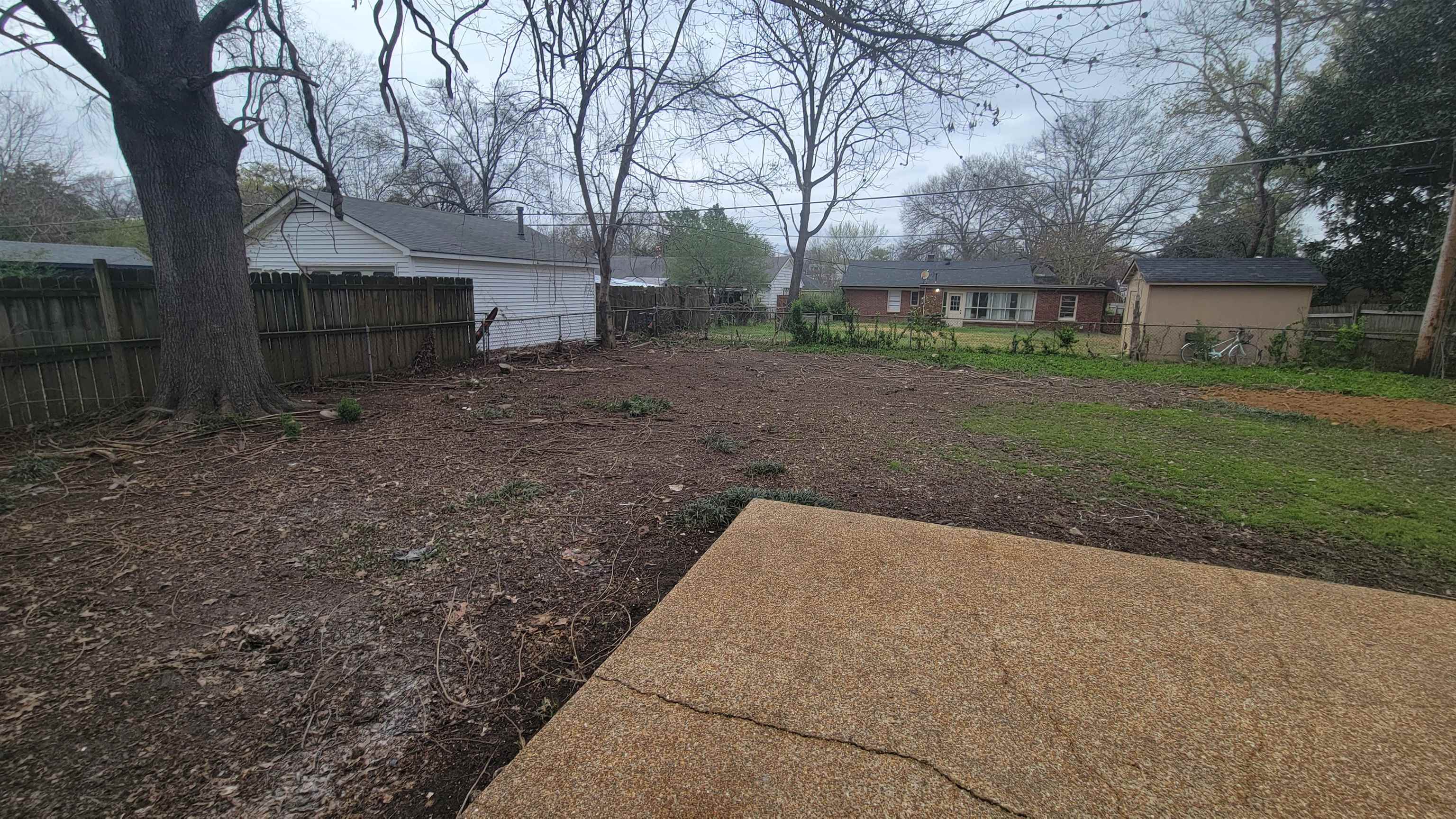 4574 Boyce Road Memphis, TN 38117 - Photo 23 of 28 a view of a house with a back yard