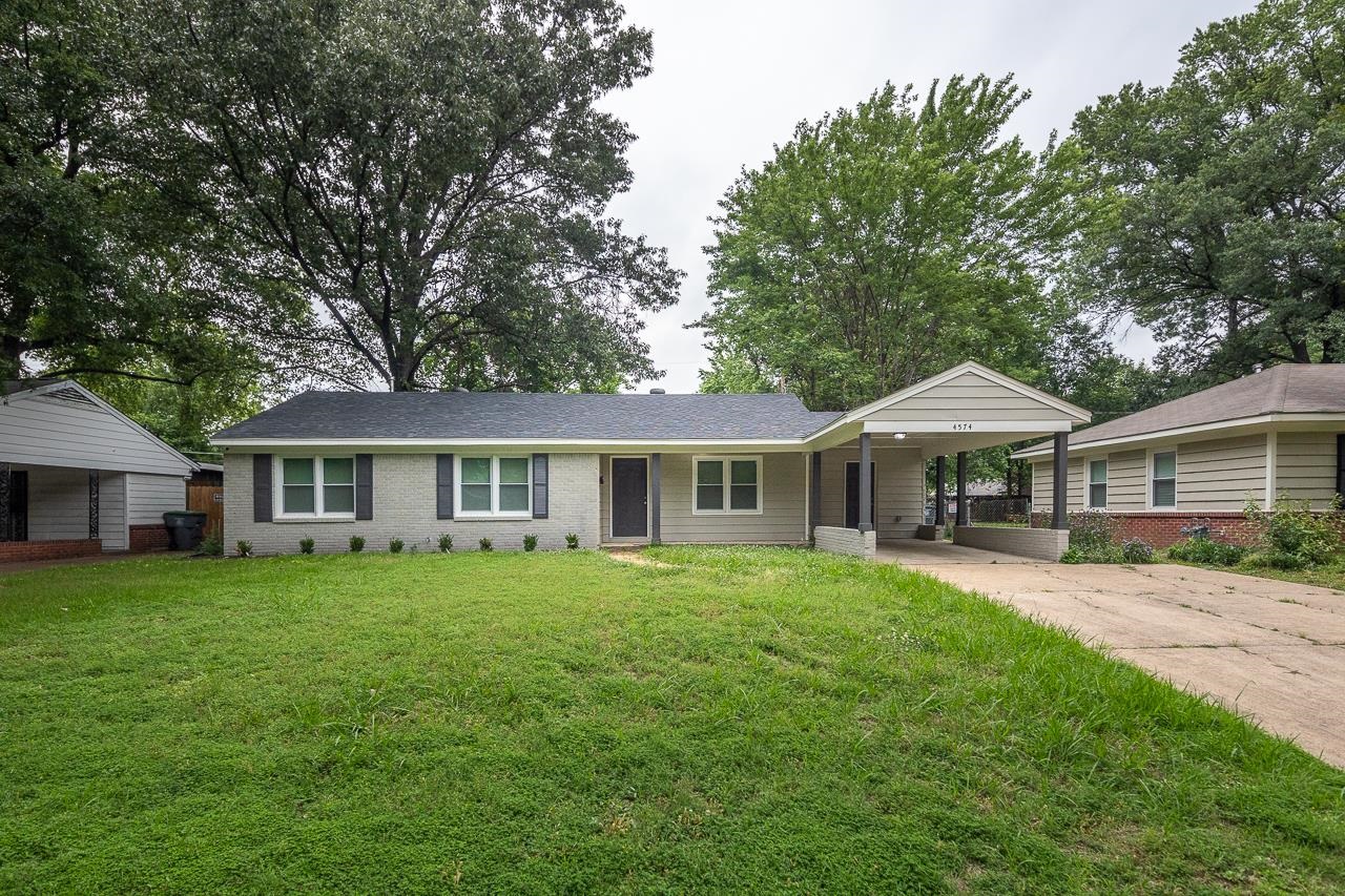 4574 Boyce Road Memphis, TN 38117 - Photo 28 of 28 a front view of a house with a garden