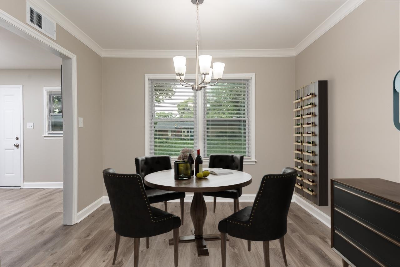 4574 Boyce Road Memphis, TN 38117 - Photo 9 of 28 a view of a dining room with furniture window and wooden floor