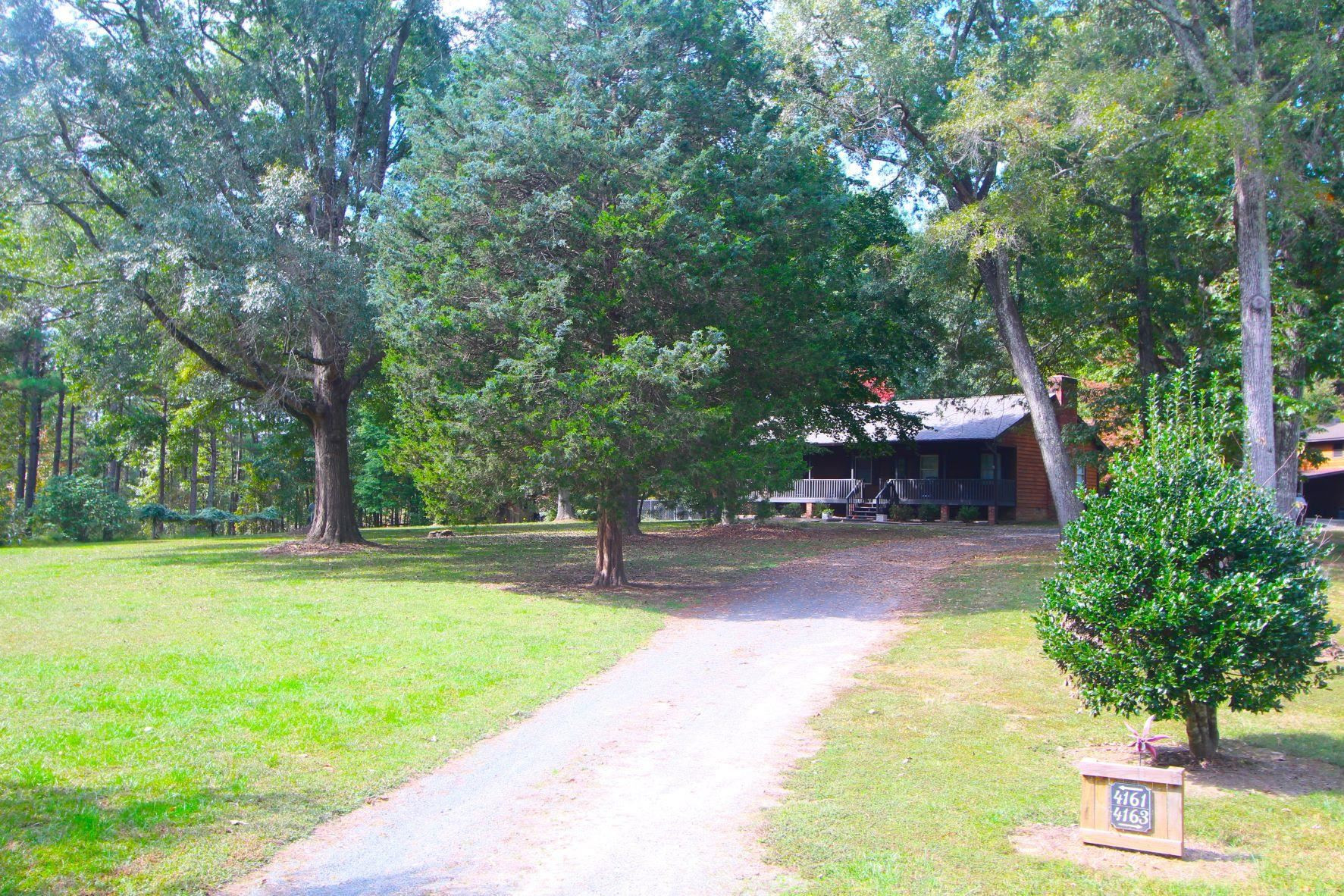 a view of a backyard with swimming pool