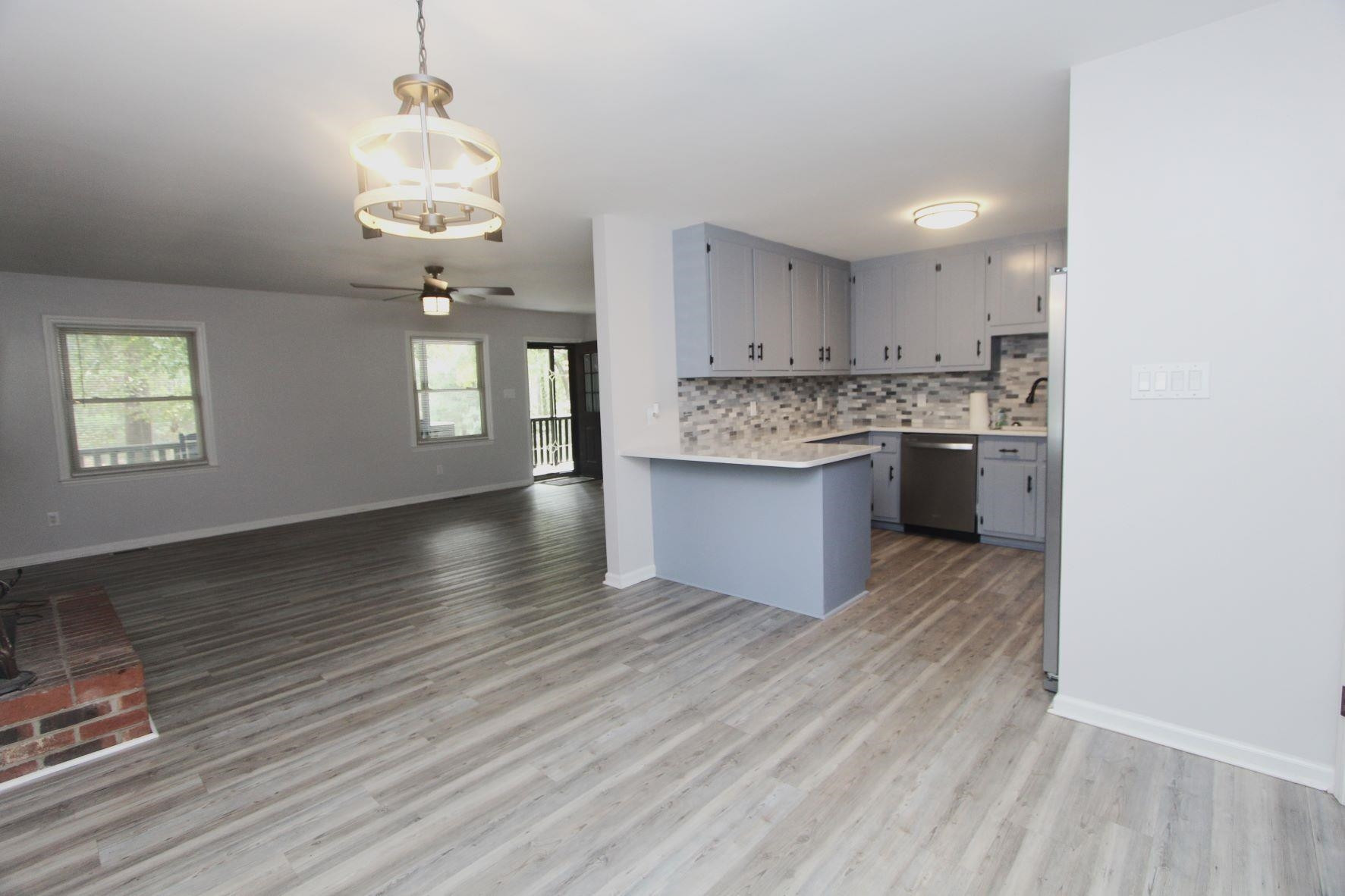 4161 Range Road Stem, NC 27581 - Photo 13 of 43 a view of kitchen and sink with wooden floor