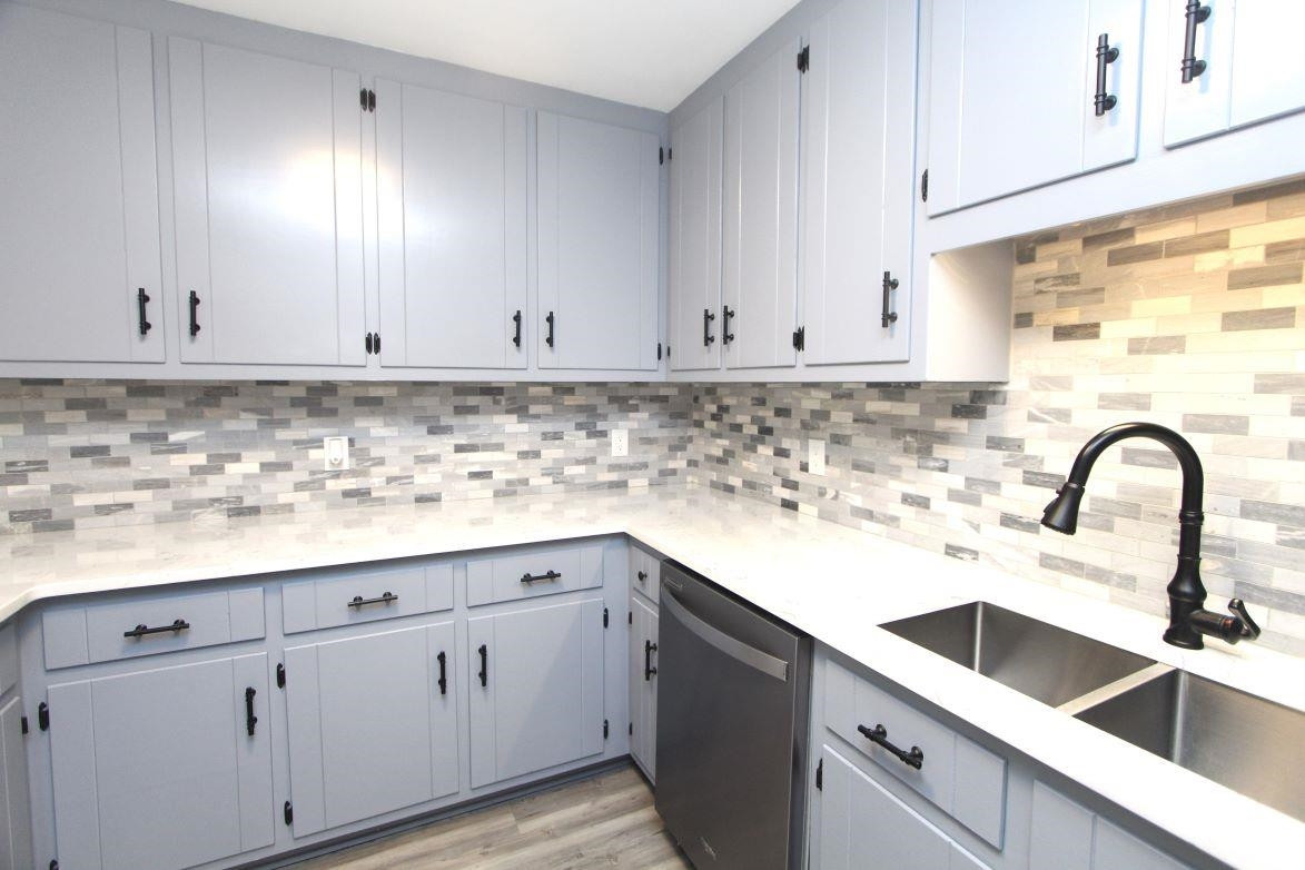 4161 Range Road Stem, NC 27581 - Photo 15 of 43 a kitchen with white cabinets and a sink