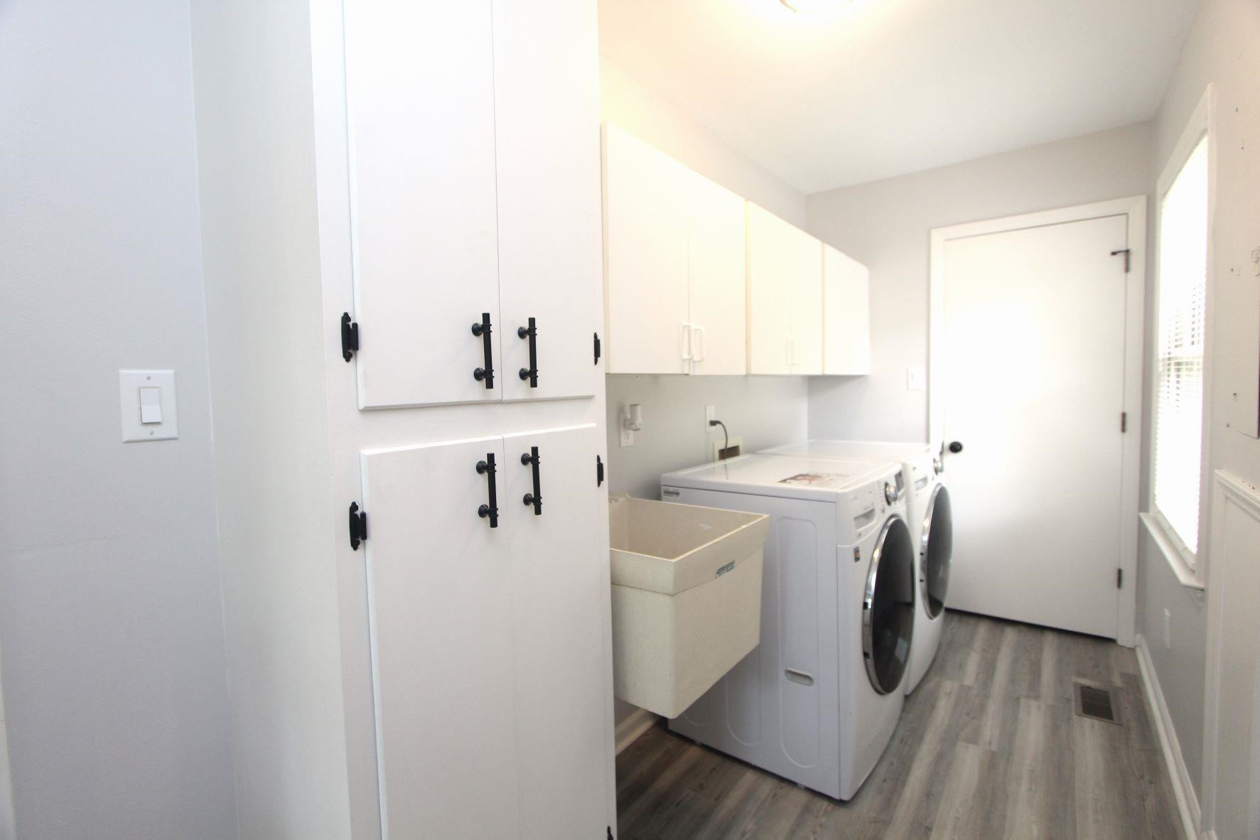 4161 Range Road Stem, NC 27581 - Photo 19 of 43 a utility room with cabinets washer and dryer