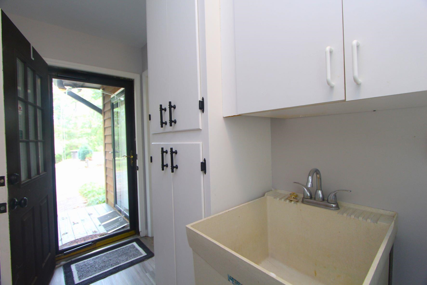 4161 Range Road Stem, NC 27581 - Photo 20 of 43 a bathroom with a tub and sink