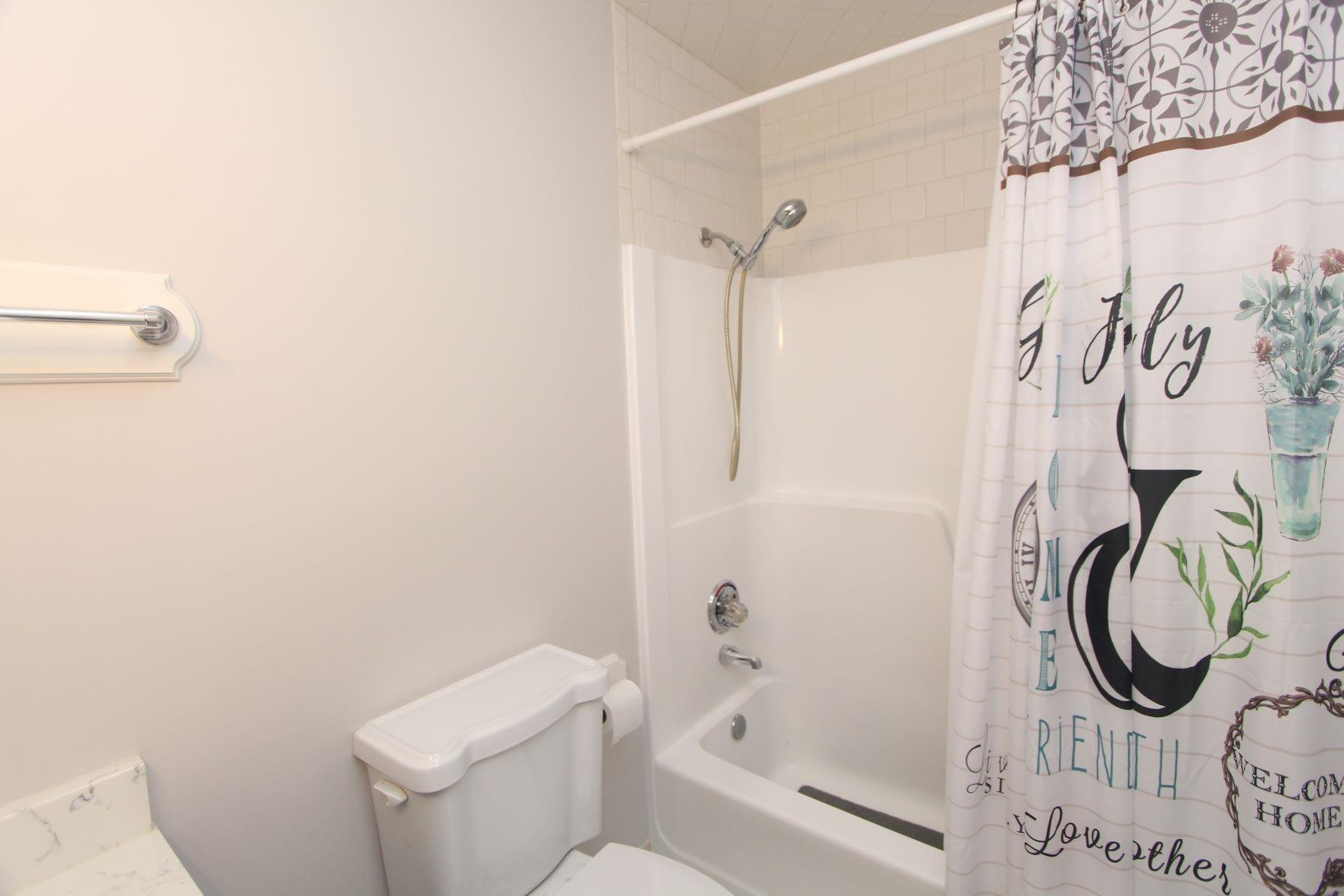 4161 Range Road Stem, NC 27581 - Photo 22 of 43 a bathroom with a toilet and a shower