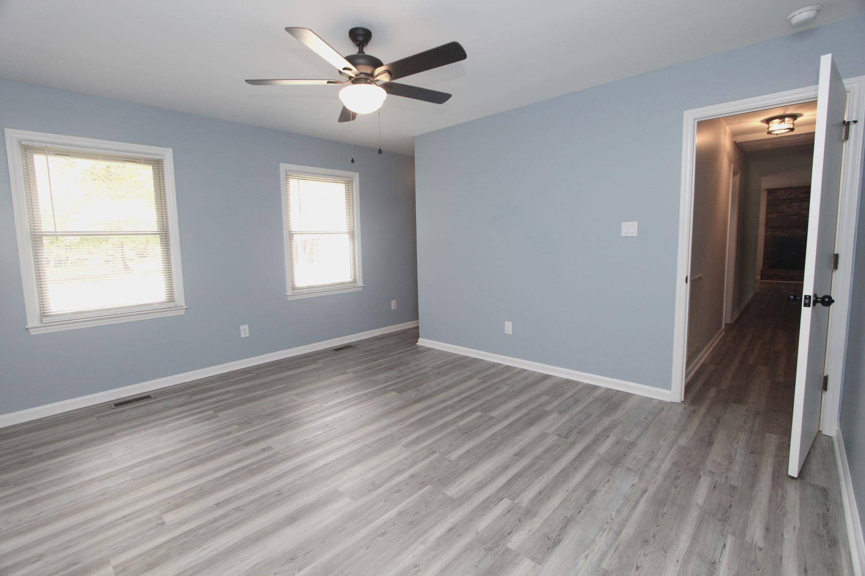 4161 Range Road Stem, NC 27581 - Photo 25 of 43 wooden floor in an empty room with a window