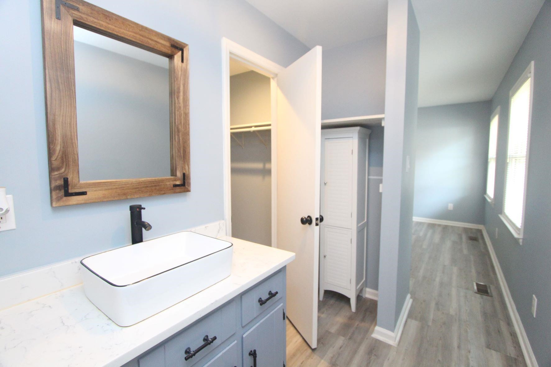 4161 Range Road Stem, NC 27581 - Photo 28 of 43 a bathroom with a sink and a mirror