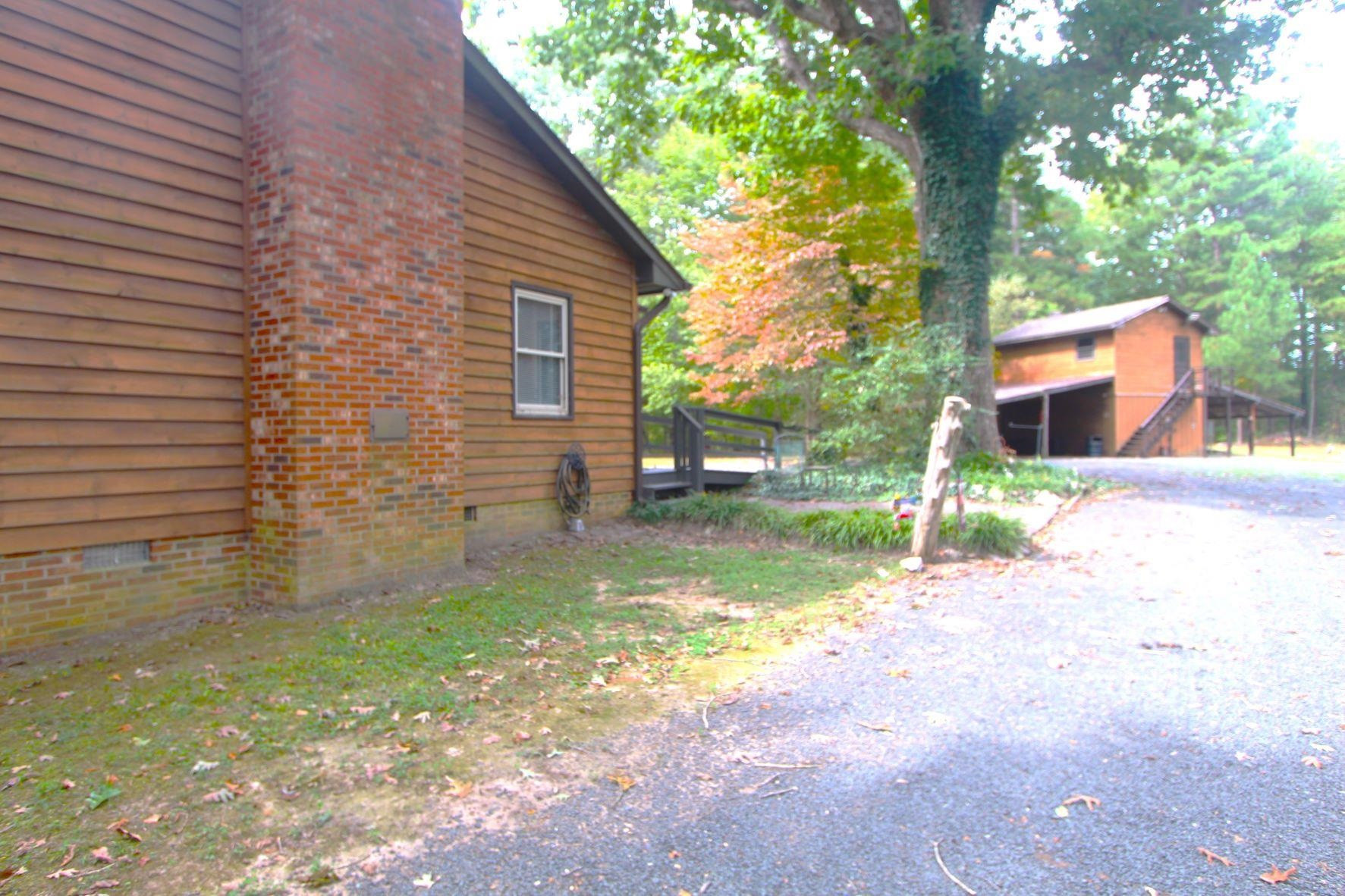 4161 Range Road Stem, NC 27581 - Photo 30 of 43 a view of a backyard with a small cabin
