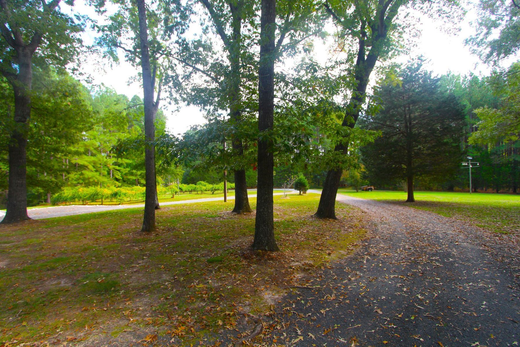 4161 Range Road Stem, NC 27581 - Photo 35 of 43 a view of a house with a yard and entertaining space