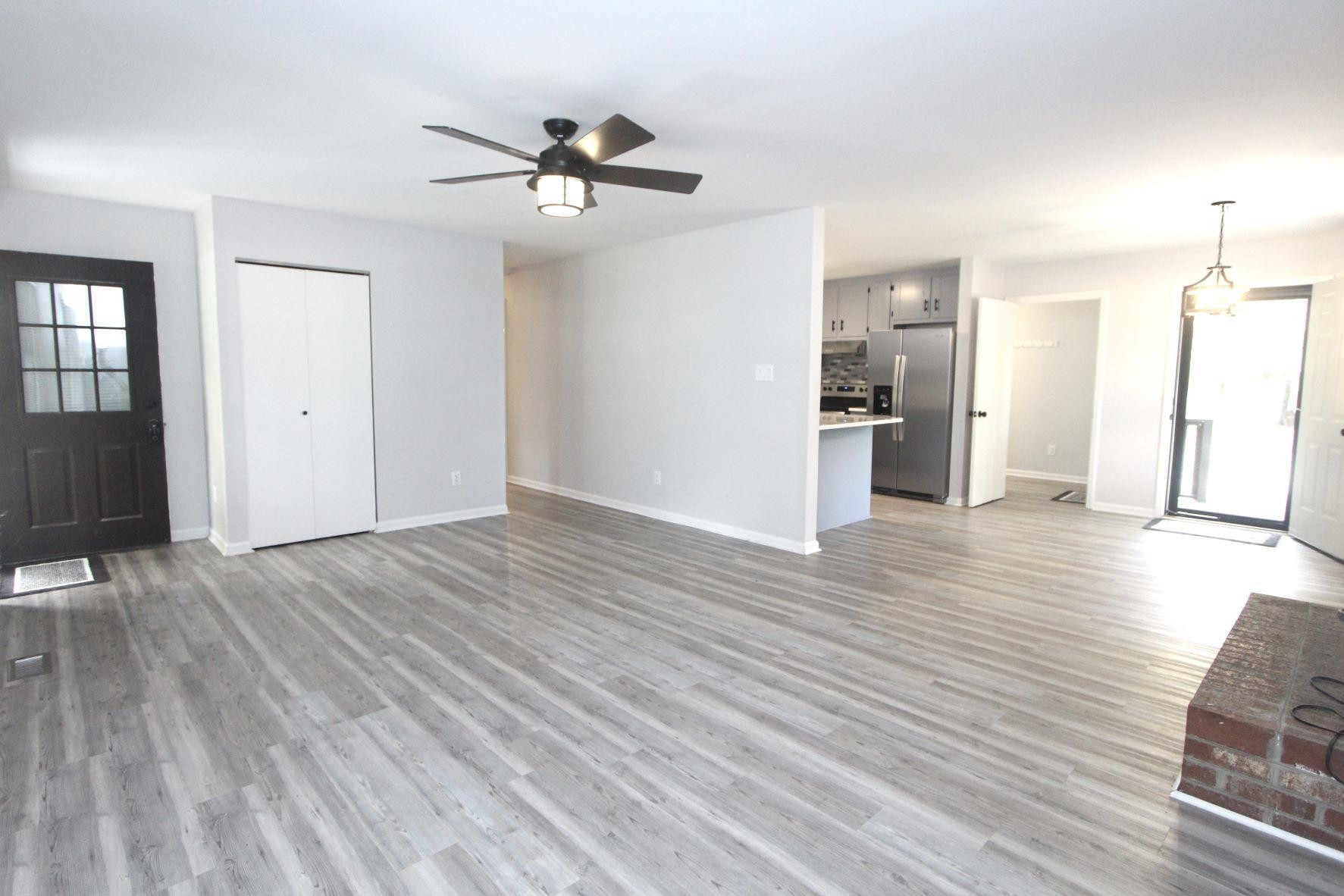 4161 Range Road Stem, NC 27581 - Photo 10 of 43 a view of a room with wooden floor and ceiling fan
