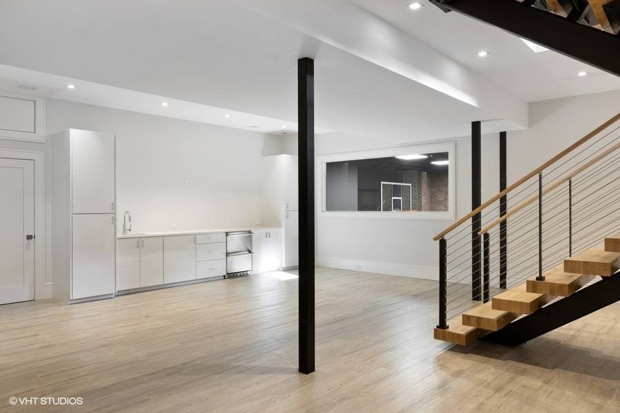 8 Crows Nest Lane East Hampton, NY 11937 - Photo 13 of 15 a view of a hallway with wooden floor and staircase