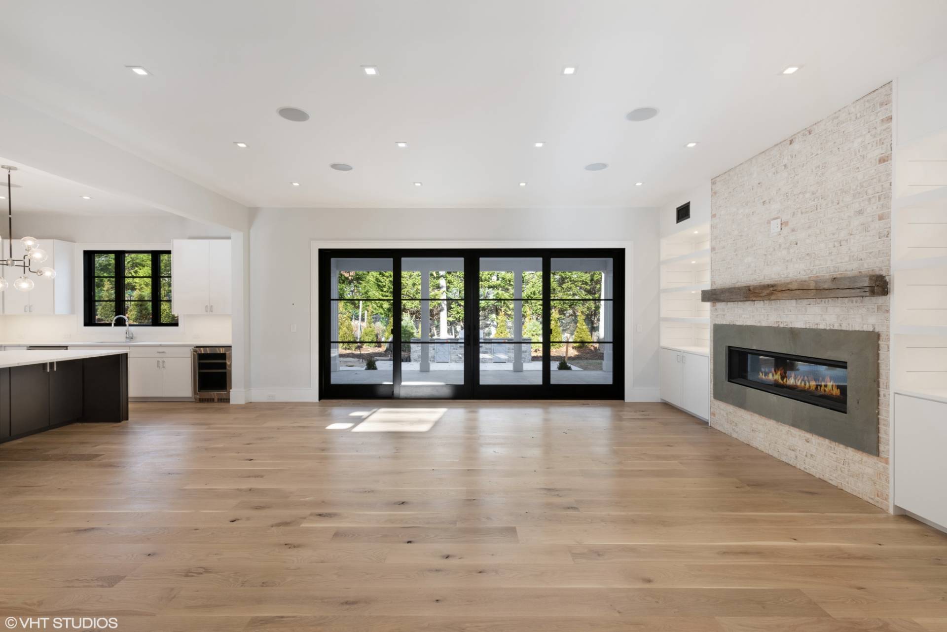 8 Crows Nest Lane East Hampton, NY 11937 - Photo 3 of 15 a view of an empty room with a fireplace and a window