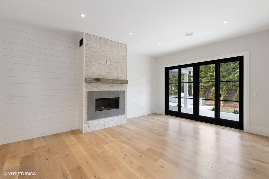 8 Crows Nest Lane East Hampton, NY 11937 - Photo 8 of 15 a view of an empty room with a fireplace and a window