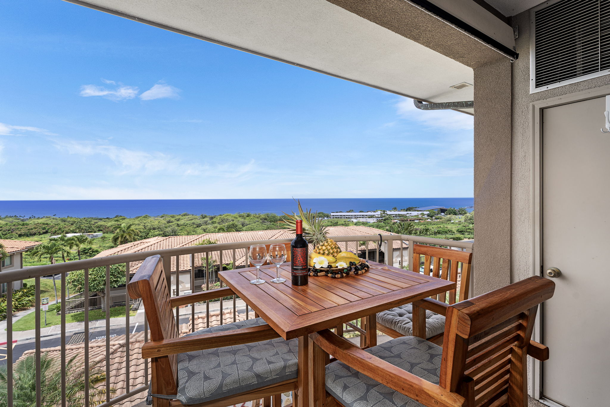 75-346 Hualalai Road, Unit B303 Kailua-Kona, HI 96740 - Photo 1 of 11 a view of a balcony with mountain view and wooden floor