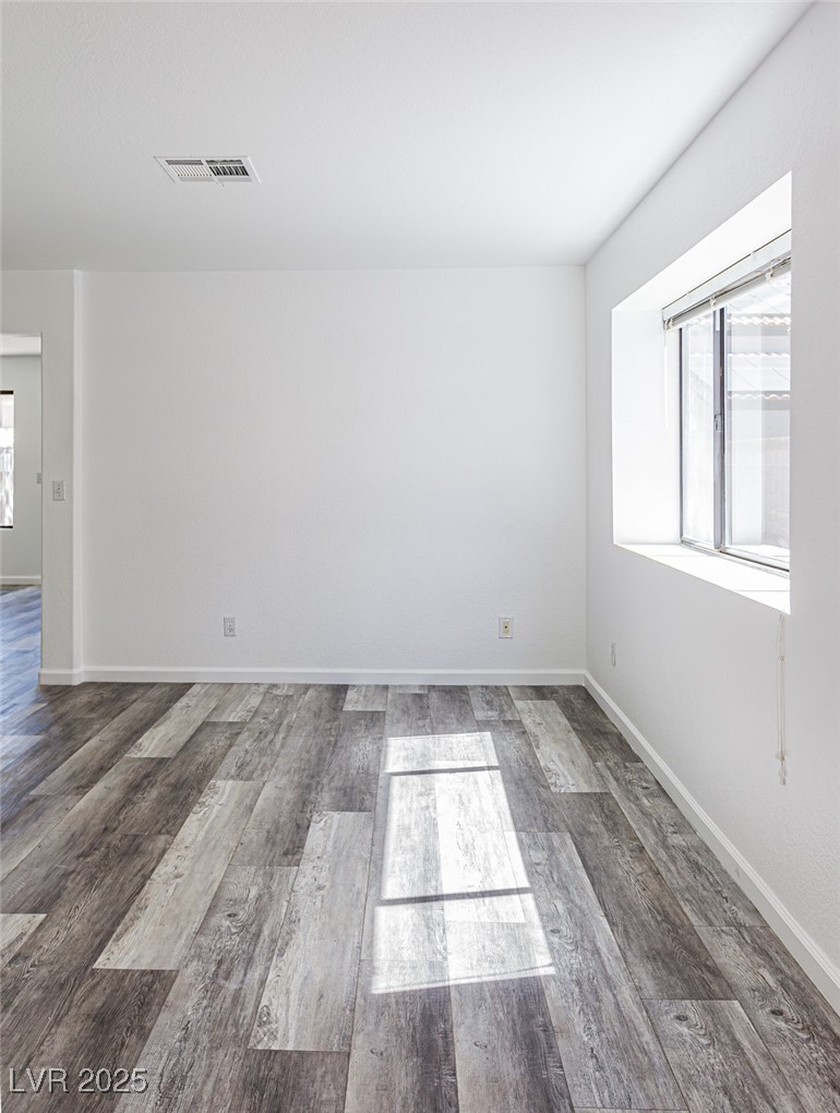 306 Lander Drive Henderson, NV 89074 - Photo 1 of 30 Unfurnished room featuring dark wood-type flooring