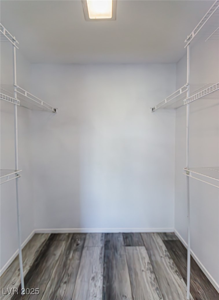 306 Lander Drive Henderson, NV 89074 - Photo 25 of 30 Spacious closet with dark wood finished floors