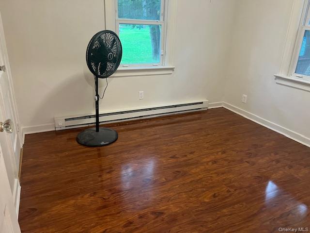 495 Community Drive Manhasset, NY 11030 - Photo 11 of 13 a view of a room with wooden floor and window