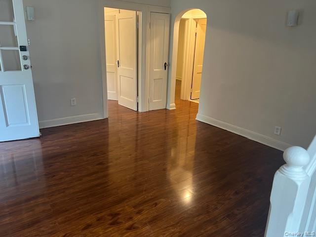 495 Community Drive Manhasset, NY 11030 - Photo 5 of 13 a view of a room with wooden floor and window
