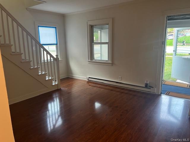 495 Community Drive Manhasset, NY 11030 - Photo 7 of 13 a view of an empty room with wooden floor and a window