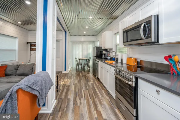 a kitchen with stainless steel appliances granite countertop lots of counter top space