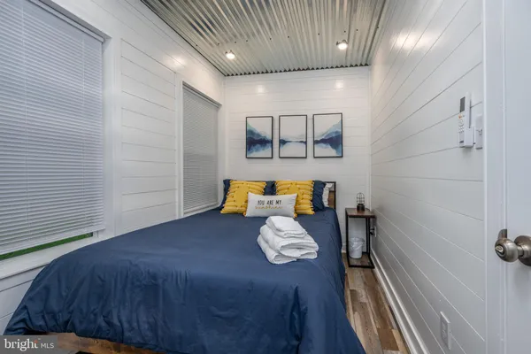 a bedroom with a bed and a dresser