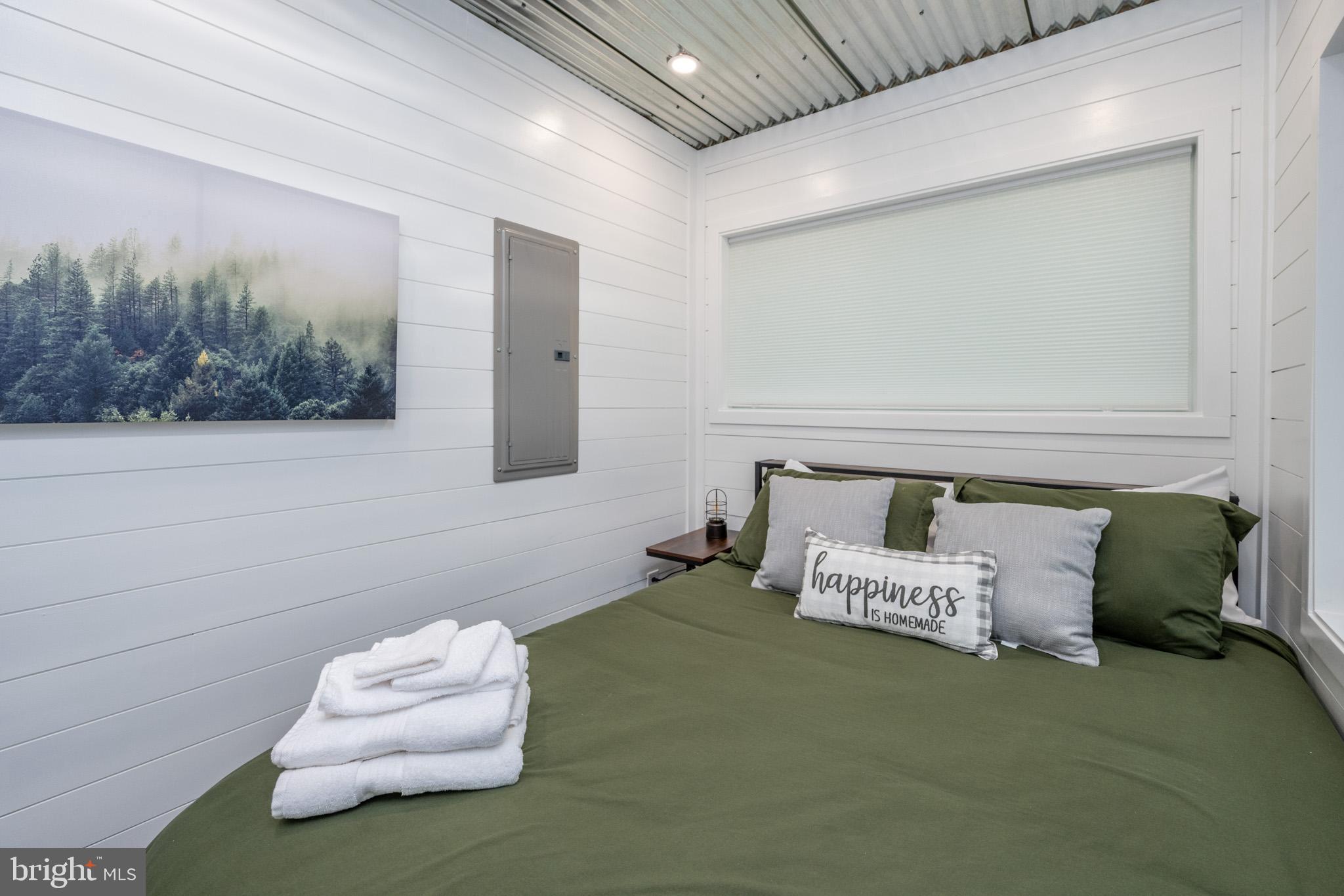 2195 Glendale Road Swanton, MD 21561 - Photo 22 of 35 a bedroom with a bed and a couch