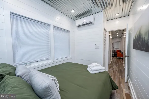 a view of a livingroom with furniture and closet