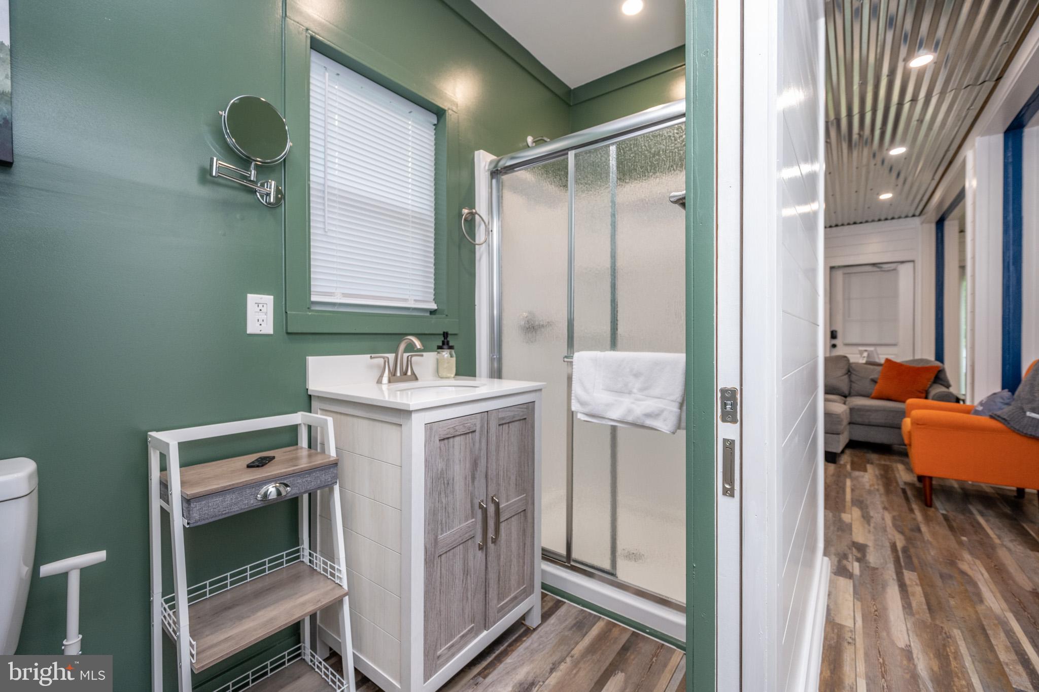 2195 Glendale Road Swanton, MD 21561 - Photo 26 of 35 a bathroom with a sink and a mirror
