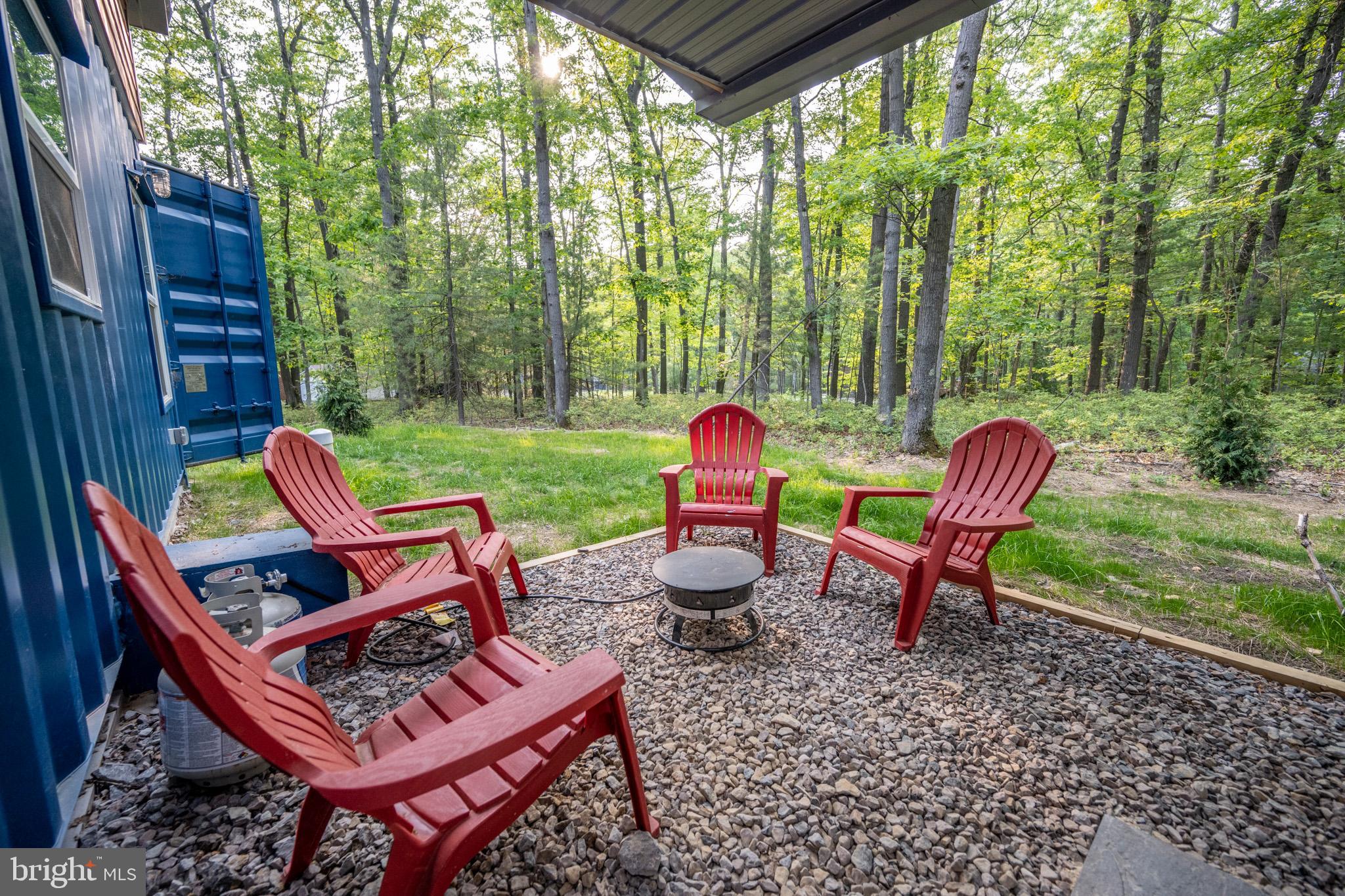 2195 Glendale Road Swanton, MD 21561 - Photo 29 of 35 a backyard of a house with outdoor seating