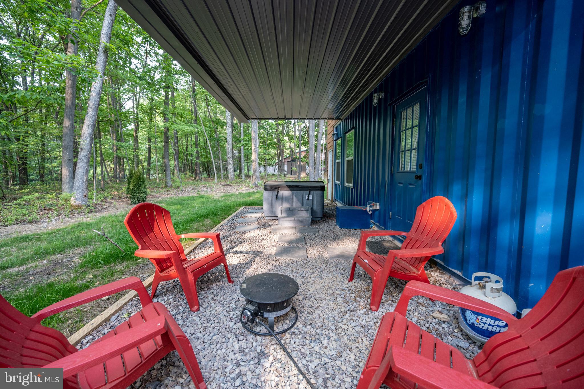 2195 Glendale Road Swanton, MD 21561 - Photo 31 of 35 a backyard of a house with table and chairs