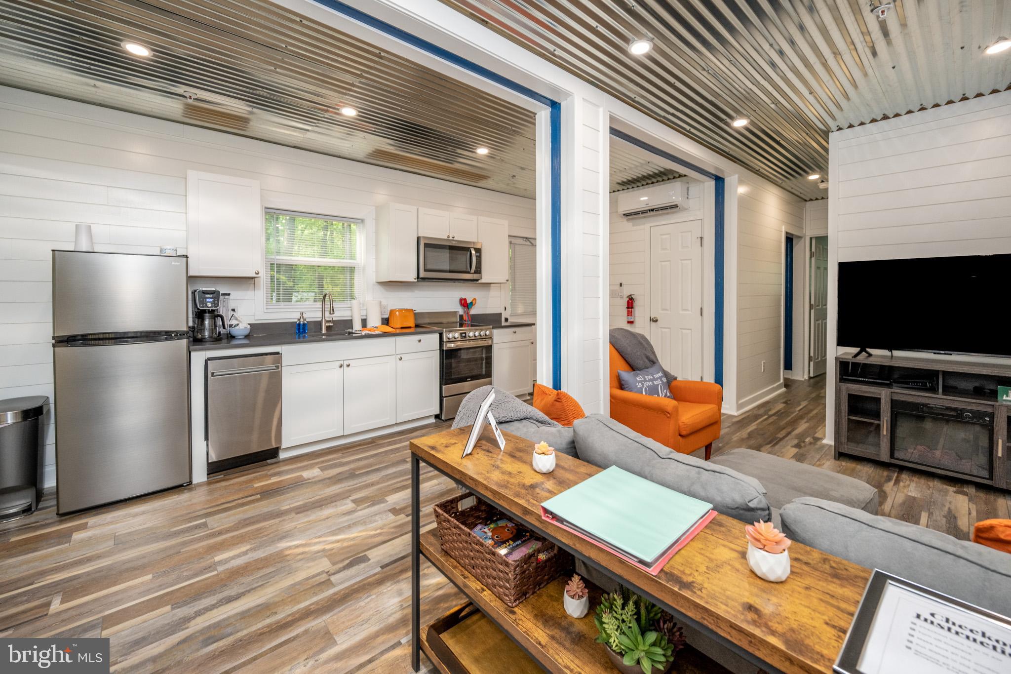 2195 Glendale Road Swanton, MD 21561 - Photo 8 of 35 a kitchen with stainless steel appliances granite countertop a stove refrigerator sink and cabinets